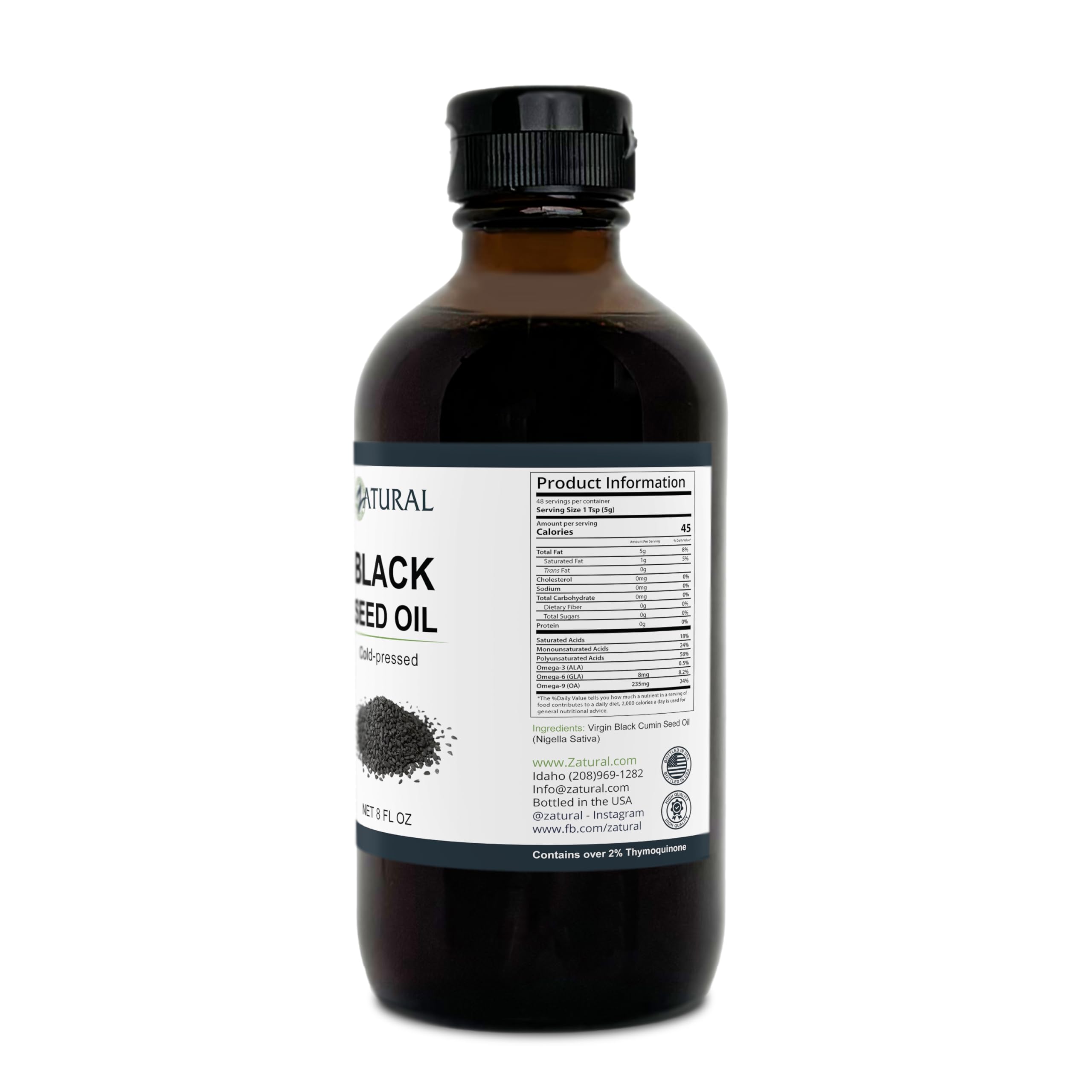 Zatural black seed oil bottle on bathroom shelf for skincare.