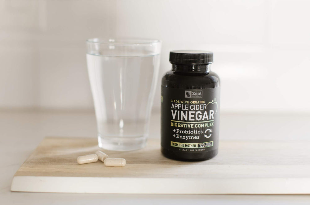Zeal Naturals daily use scene with capsules and water for gut health