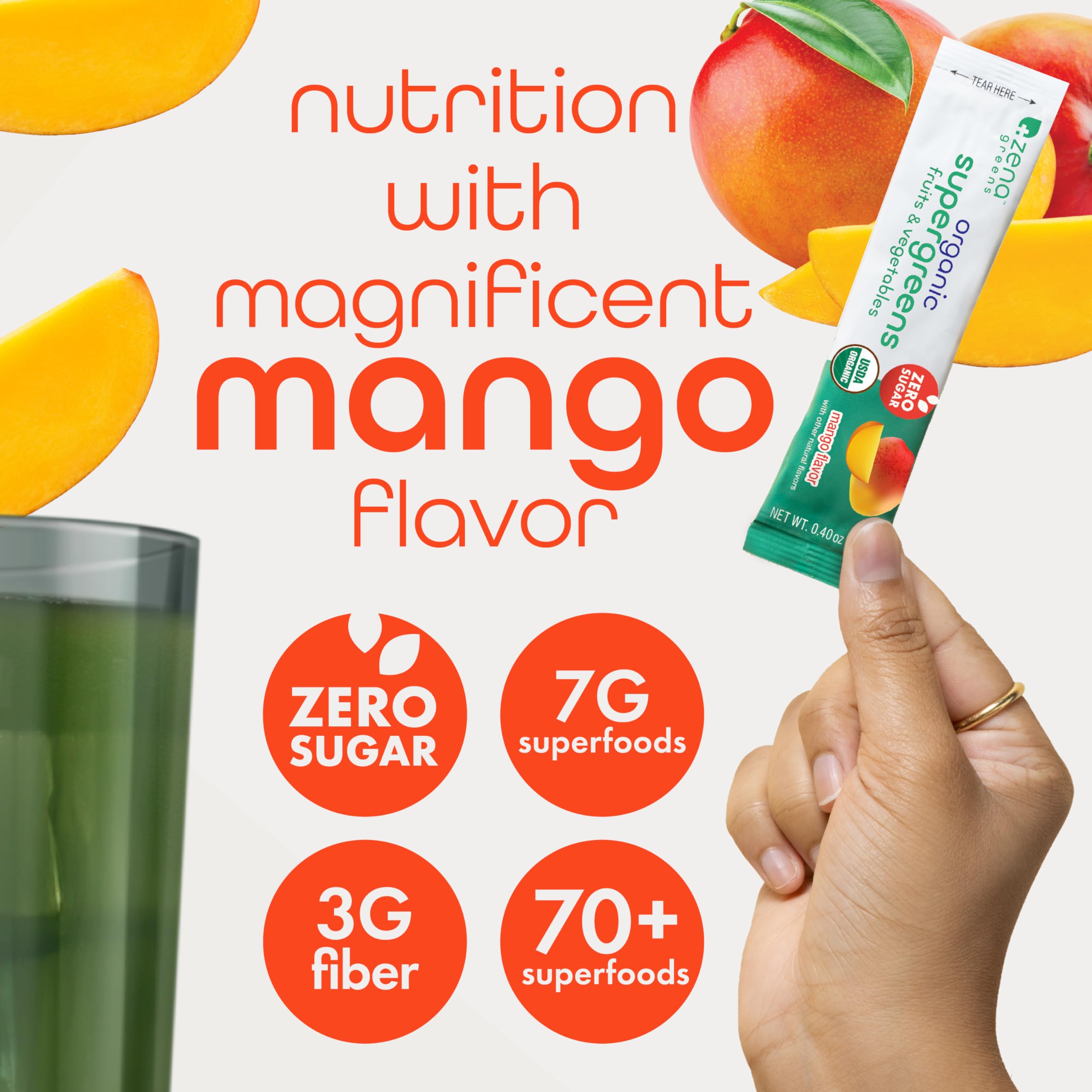 Mango flavored greens powder poured into a glass.