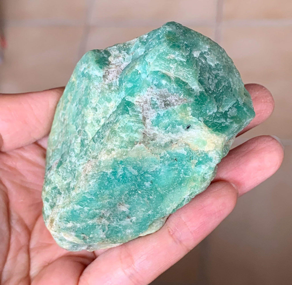 Zenkeeper amazonite rough stone shines in altar displays and rituals.