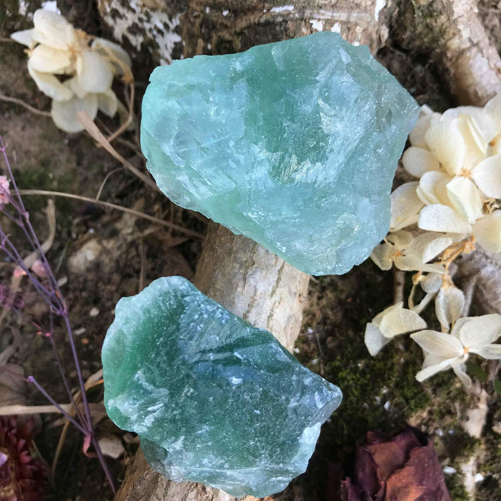Zenkeeper green fluorite stones with natural variations for unique craft projects.