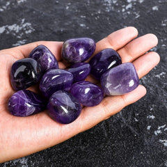 ZenQ amethyst stones in drawstring bag for gifting and storage.