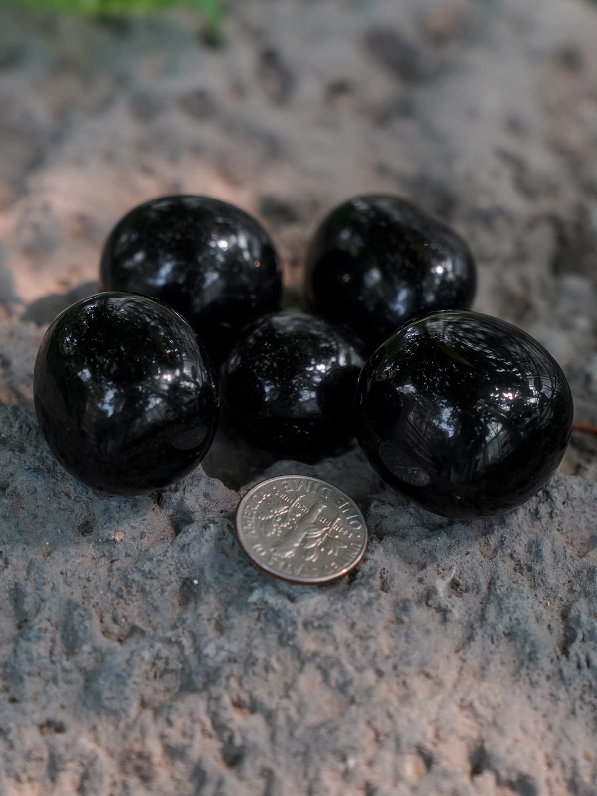 ZenQ black obsidian stones housed in a drawstring gift bag.