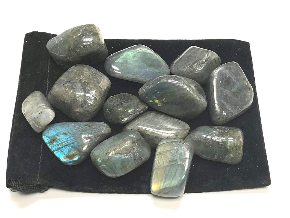 Close-up of Zentron Labradorite tumbled stones showing variegated patterns and iridescence for displays.