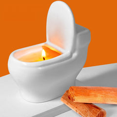 Zhanghe toilet-shaped candle with sandalwood scent enhances humor and ambient fragrance in any room.