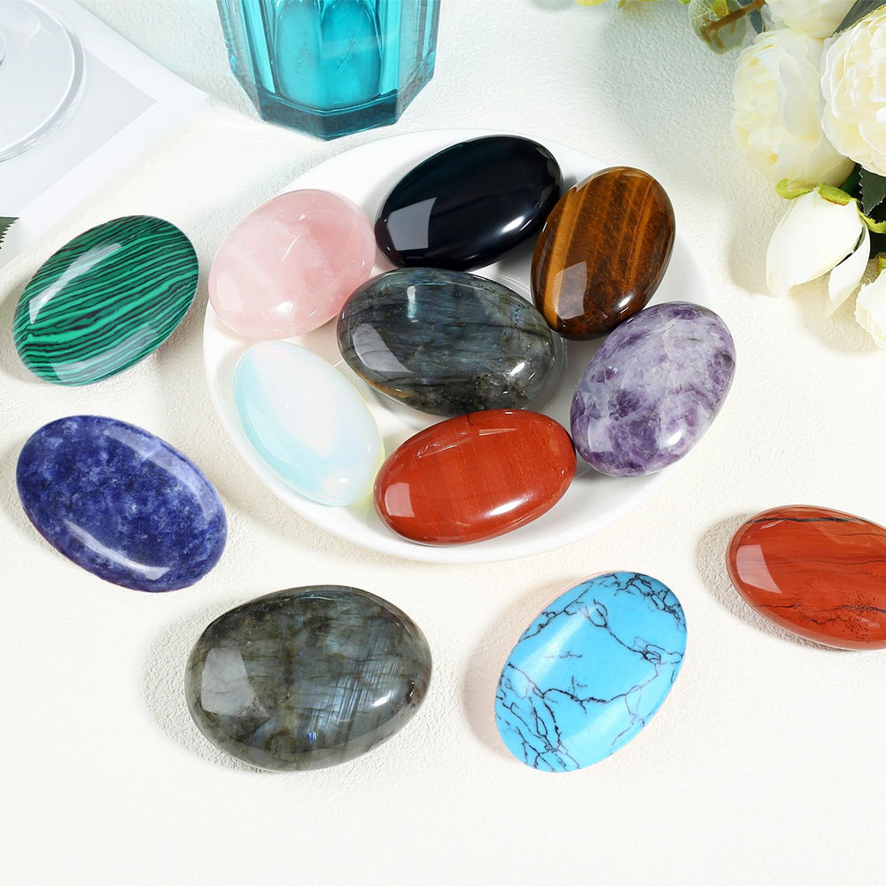 Zhiyuxi blue sodalite palm stone used as desk decor to foster balance.