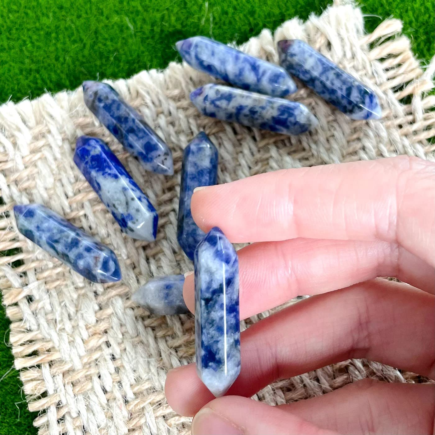 Close-up of ZHIYUXI blue white sodalite wand texture for calming energy