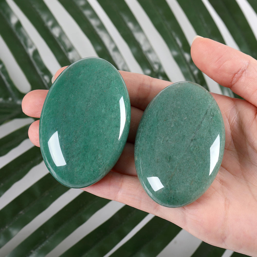 ZHIYUXI green aventurine palm stone close-up showing the polished surface.