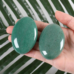 ZHIYUXI green aventurine palm stone close-up showing the polished surface.