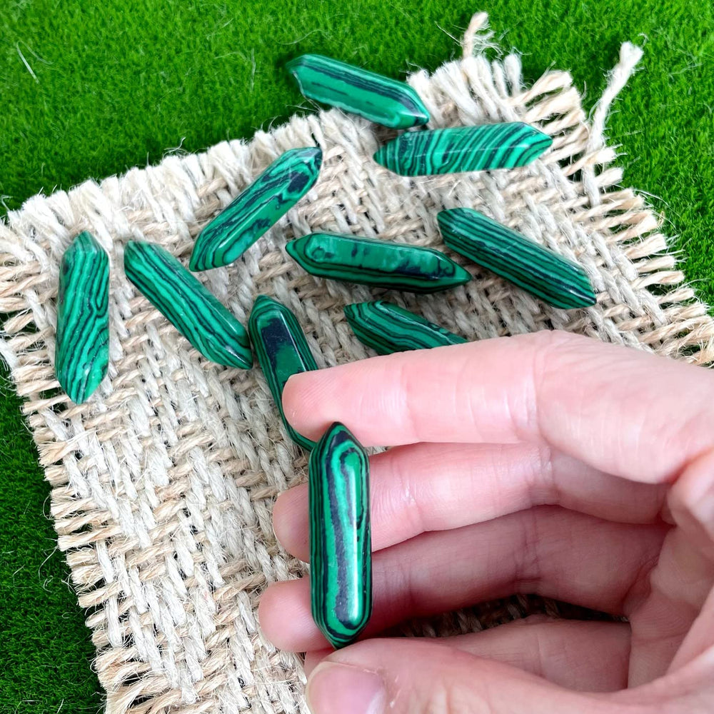 Close-up of ZHIYUXI Malachite wand reveals natural banding and energy focus