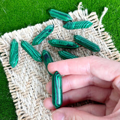 Close-up of ZHIYUXI Malachite wand reveals natural banding and energy focus