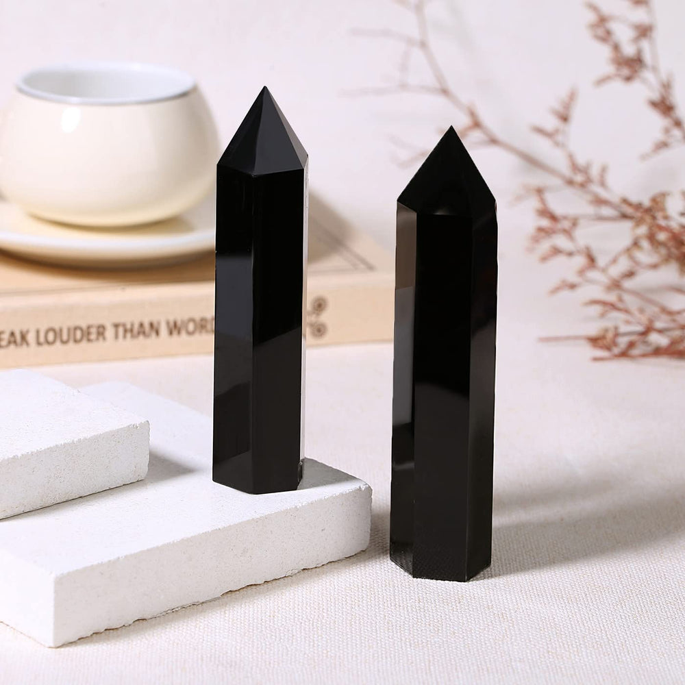 Zhiyuxi obsidian wand tip geometry highlights precise hexagonal point for energy work.