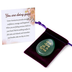 ZHIYUXI One Day at a Time worry stone in hand for calming focus.
