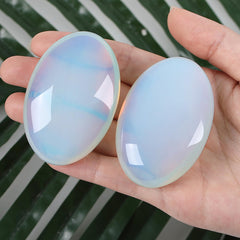 Opalite palm stone used for meditation and energy balance in daily routines.