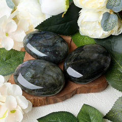 Holding the ZHIYUXI oval palm stone during meditation.