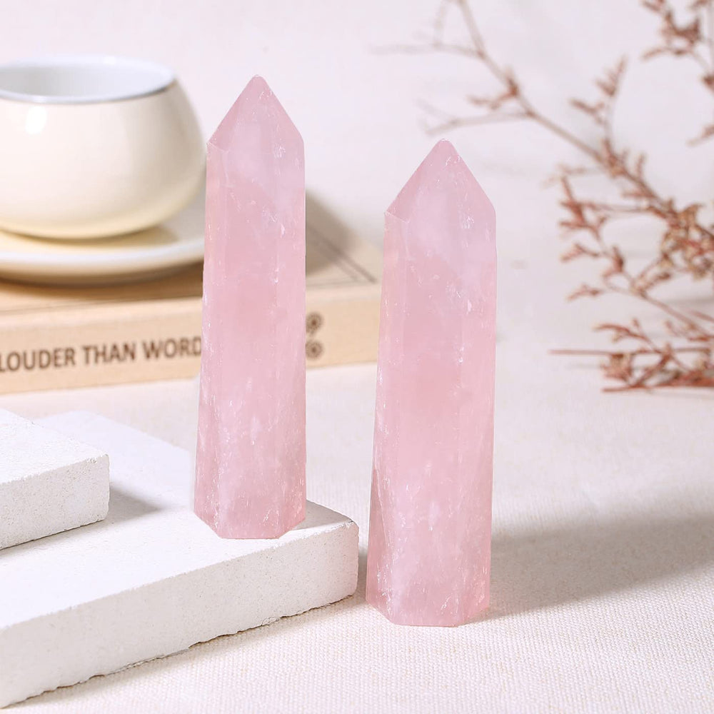 ZHIYUXI rose quartz wand used during meditation practice.