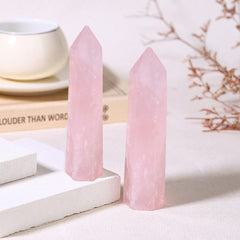 ZHIYUXI rose quartz wand used during meditation practice.
