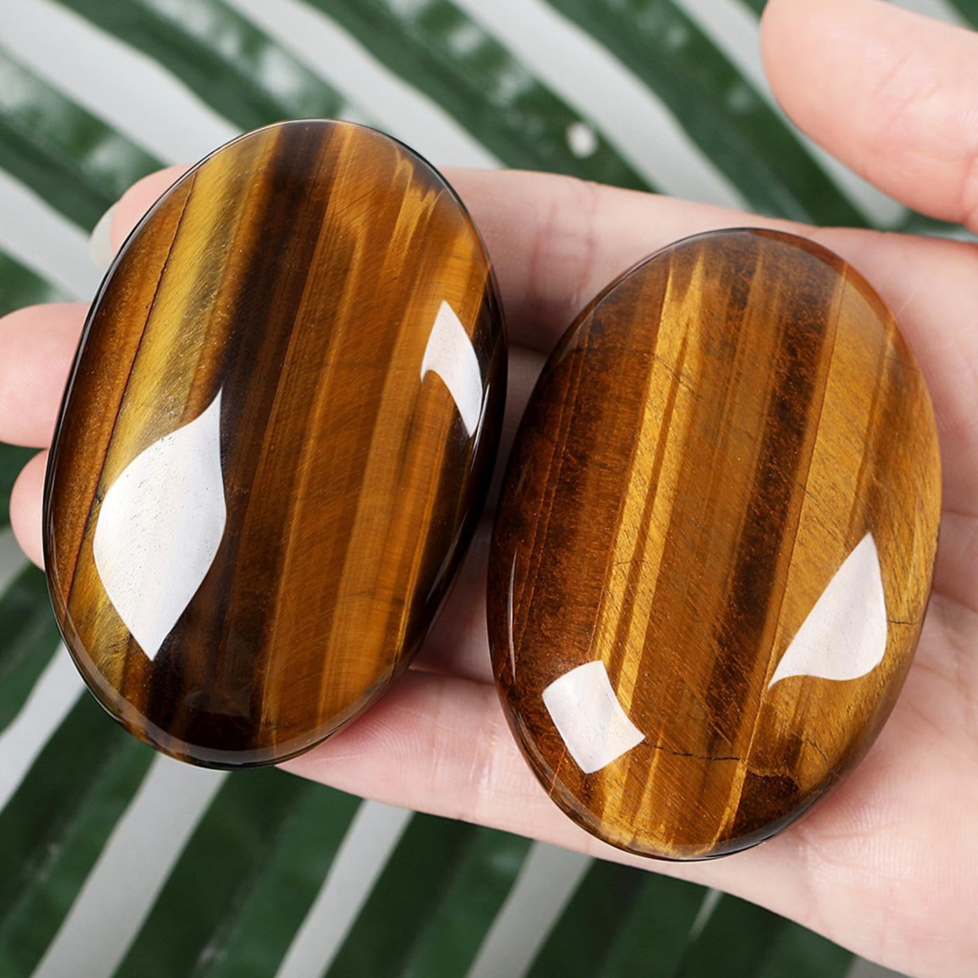 ZHIYUXI tiger's eye palm stone held in hand for grounding and concentration