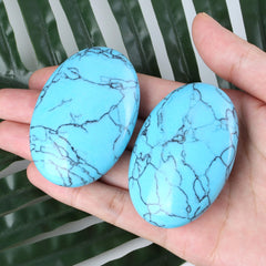 Turquoise oval palm stone used during meditation by ZHIYUXI