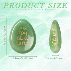 ZHIYUXI Close-up of the thumb groove on green aventurine worry stone.