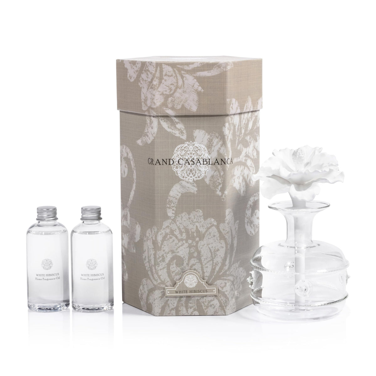 Zodax Grand Casablanca porcelain diffuser with flower design enhances living room ambiance.