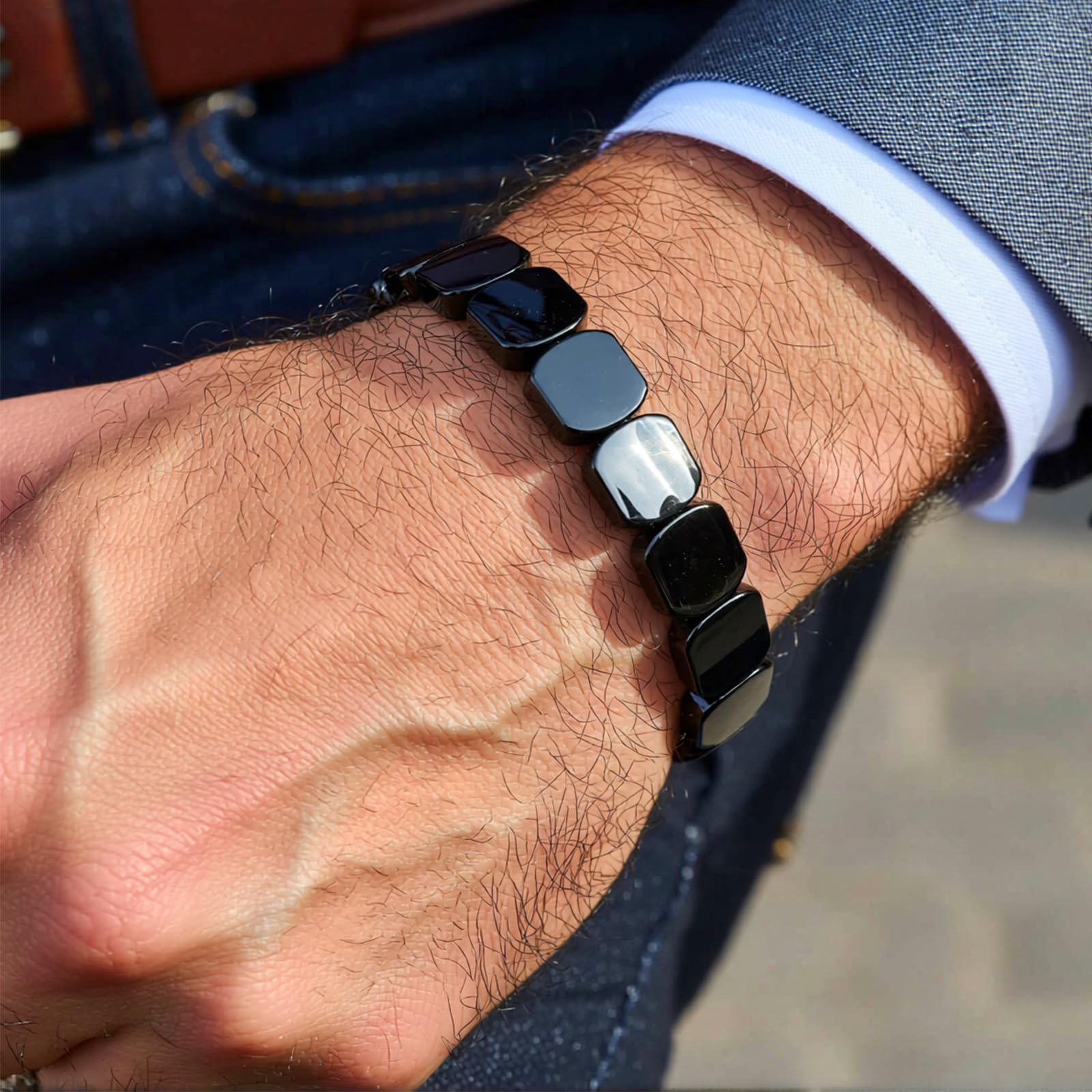 ZOYYE men's hematite bracelet stretch fit on wrist for comfortable all-day wear.