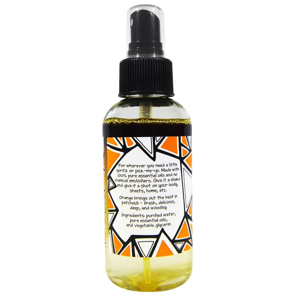 Zum Mist Patchouli-Orange spray in hand ready to freshen spaces.