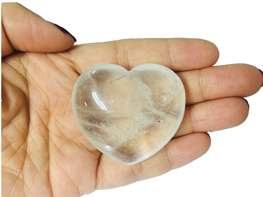 Zungtin carved crystal heart used for chakra balancing and Reiki energy flow.